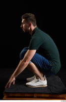  Trent  1 blue jeans casual dressed green t shirt kneeling white sneakers whole body 0003.jpg